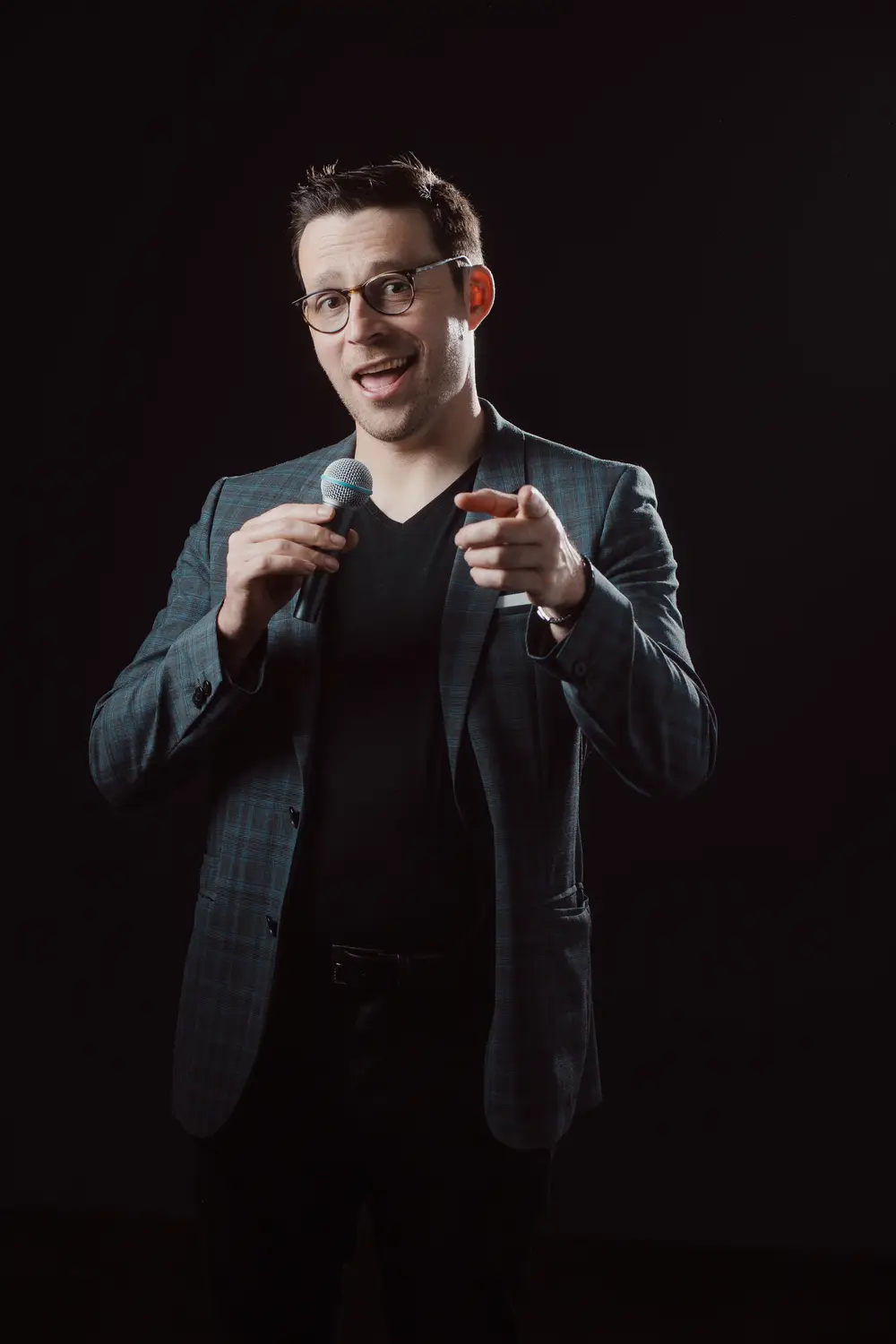 Hugo Marceau, AI keynote speaker and mentalist, on stage with a microphone