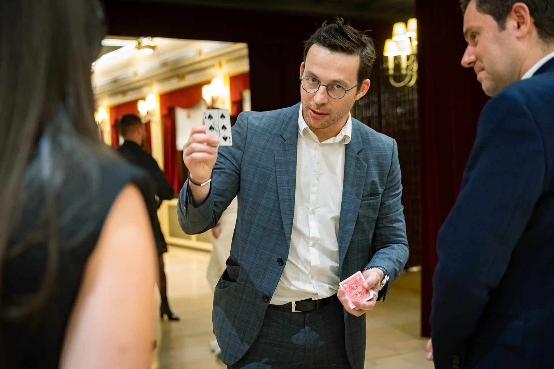 Close-up magic among the guests at a corporate dinner